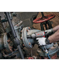 Person using Half Inch Drive Quiet Tech Air Impact Wrench With Up To 1300 Ft Lbs Torque For Pro Grade Assembly and Disassembly