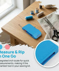 Magnetic Seam Guide for Sewing Machine Handy Hemmer Guide With Scale, blue tool on table with sewing materials.