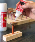 Thick CA Glue Refill Kit 16 Oz For Woodworking And DIY Projects On Your Workbench Bulk Refills With Extra Bottles Caps Microtips Yorker Spout Gap Filler Cyanoacrylate For Carpentry Hobby Models And Archery Fletching, hand applying CA glue to a wood joint