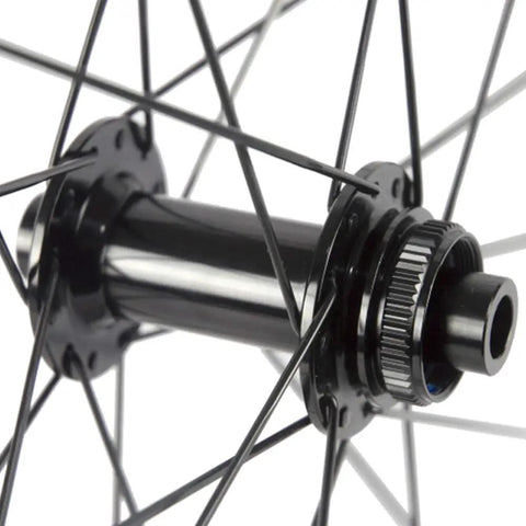 Close-up of center lock hub on 38mm Carbon Tubeless Disc Road Wheelset 700C with 12x142mm rear axle, 31mm wide rim.