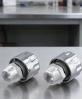 2-Pack NPT Threaded Breather Cap Reducer With 40 Micron Oil Filter For Gear Tanks on a workbench, showcasing steel construction.