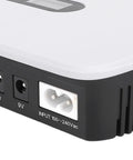 Close-up of Portable Ups Battery Backup 10400 Mah With Lcd Screen showing input and output ports for 5V 9V and 12V devices.