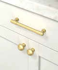 10 Pack Brushed Gold Cabinet Pulls and Drawer Handles 5 Inch Center to Center on white cabinet.