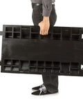 Person carrying Three Channel High Profile Drive Over Cable Protector For Heavy Duty Loads Up To 28,420 Pounds With Polyurethane Construction