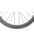Close-up of 50mm Carbon Clincher Wheelset For 700C Road Bikes Tubeless Ready With Laser Brake Surface, side view showing rim and spokes