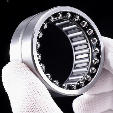 Top Shelf Heavy Duty Needle Roller Bearing NKIB5908 40X62X34mm held in hand with silver finish for high torque applications.
