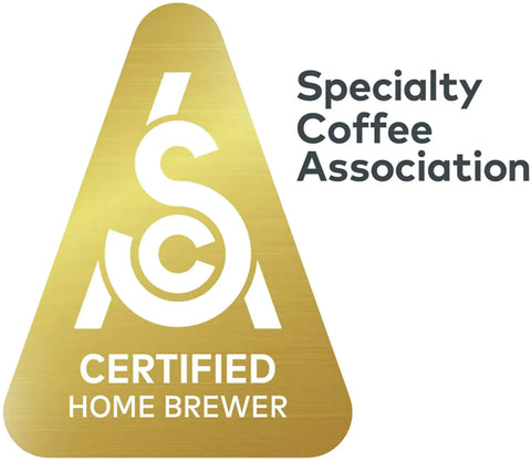 Specialty Coffee Association Certified Home Brewer logo on a gold triangle background.