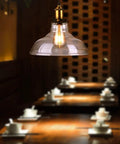 Vintage Edison Style LED Filament Bulb 40W Equivalent E26 Non Dimmable illuminating a stylish dining area