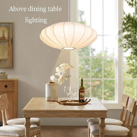 Italian Silkworm Cocoon Pendant Light With White Faux Silk Drum Shade above dining table, 50 cm