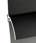 Close-up of Bulletproof Door Bottom Sweep With Rain Drip Cap in black aluminum with grey vinyl insert for weather stripping.