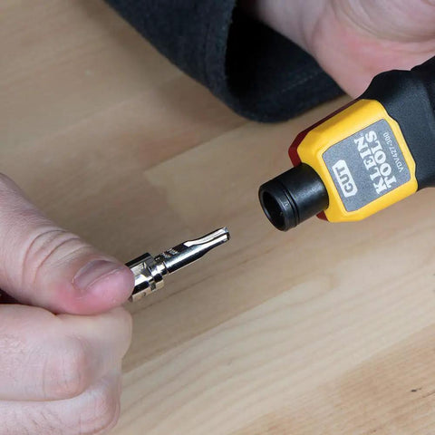 VDV427-300 Impact Punchdown Tool Pro-Grade With 66/110 Blade in use, hand-held, showcasing adjustable force feature on wood surface.