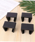 Four Pack Sturdy Chair Clips For Rattan Furniture, Sofa Fasteners And Corner Connectors on wooden surface