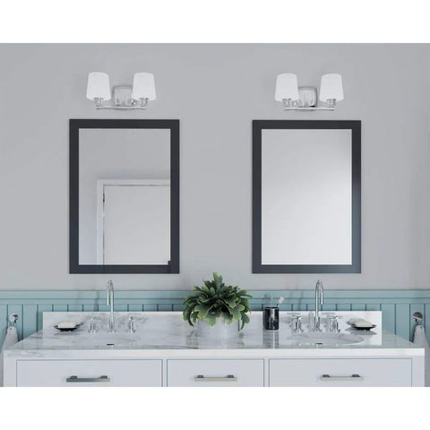 Glance Two-Light Bath Vanity Light In Brushed Nickel With Etched Linen Glass Shades over mirrors in a modern bathroom