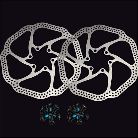 Two 180mm 6 Bolt Stainless Steel Disc Brake Rotors for Road, Mountain, MTB and BMX Bikes with bolts on a black background