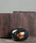 Snag This Top Shelf Vintage Chinese Ceramic Tea Tin With Heavy Duty Airtight Lid Perfect For Stashing Fresh Coffee Beans Candy Spices And Condiments on a kitchen counter with wooden backdrop.