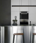 Modern kitchen with stainless steel finishes, showcasing durable furniture trim. Gray Edge Banding 2 Inch by 50 Foot Non Glued Flexible Pro Grade