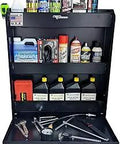 Aluminum Trailer Door Cabinet Organizer With Flip Out Work Tray And Spring Loaded Paper Towel Tensioner, stocked with tools, oil, and aerosols.