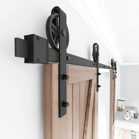 Heavy Duty Sliding Barn Door Hardware Kit For Wood Doors Double Track With Big Spoke Wheel Rollers installed on a wooden door