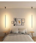 Nordic LED Pendant Lights Modern Pendant Lamp for Home Hanging Lamps Indoor Lighting Living Deco Minimalist Light Fixture in black color above a bed.