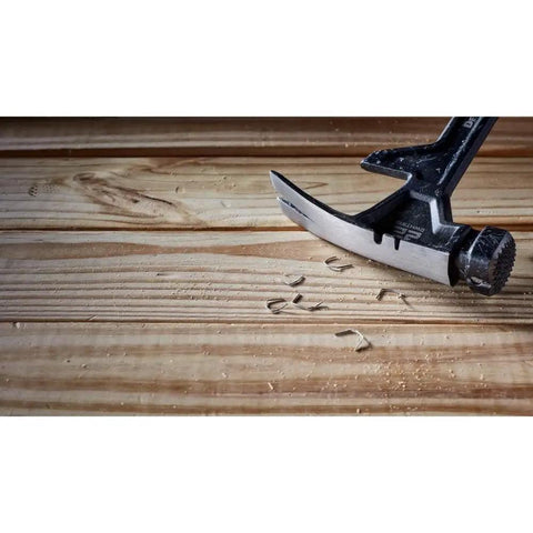 ToughSeries 22 Oz Demo Hammer With Magnetic Nail Starter and extended claw on wood surface, showing board grabbing capability.