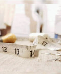 Soft Tape Measure With Dual Scale 60 Inch Vinyl Ruler For Sewing Tailor And Body Measurements, shown with fabric and pins