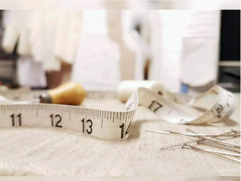 Soft Tape Measure With Dual Scale 60 Inch Vinyl Ruler For Sewing Tailor And Body Measurements, shown with fabric and pins