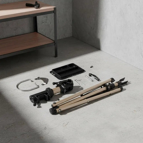 Disassembled parts of a Foldable Aluminum Bike Repair Stand With Height Adjustable Arm, ready for assembly on concrete floor.