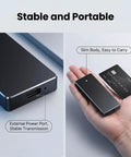 2TB Portable External SSD With USB 3.1 Dope Speed Transmission, M2 SATA Compatible Portable Solid State Drive For Android Windows MacOS, Ultra Slim Design Includes Storage Bag Black shown in hand with power port