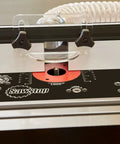 Built Tough Heavy Duty Four Post Router Lift With Dead Nuts Precision Chain Synchronized Height Adjust and Rock Solid Positive Lock System installed on a woodworking table.