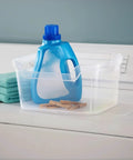 Solid As A Rock Clear Storage Bins Three Pack Tough As Nails Transparent Plastic Crates Built For Closet Shelf And Garage Organizing Zero Fuss Setup Measuring 14 By 11 By 7 Inches with laundry detergent and clothespins.