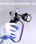 Hassle Free Airless Paint Spray Gun Kit With Five Reversible Tips Ten Spare Mesh Filters And Safety Nozzle Guard in use.