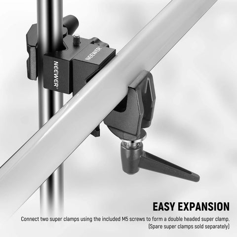 NEEWER camera clamp with 5/8 in stud and spring lock, installed on a metal bar for photography and lighting mounting.