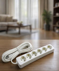 Six Outlet Power Strip With 16 Foot Cord Heavy Duty Extender Grounded Surge Guard on a wooden table in a bright living room.