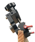 Pro Grade Self Centering Doweling Jig Kit With Anodized Finish For Easy Accurate Woodworking And Furniture Assembly Includes Precise Alignment Etched Guides Three Drill Bits Sleeves And Limiters For Quick Clean Joints, side view of doweling jig clamped to wood, close-up.