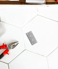 Stainless Steel Corner Brace Set 10 Pcs Flat Mending Plates No Rust Built To Last Heavy Duty Corner Brackets on white tile