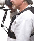 Camera Harness System With Dope SteadyShot Bracket For Stable Video Shooting Rig, black finish on person using large lens DSLR.