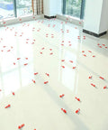 Tile Leveling System Clips 4000 Pieces DIY Friendly Leveler Spacers for Ceramic Tile and Stone Installations With 1/32 Inch Grout Joint Works on Wall and Floor Tiles Fits 1/8 To 1/2 Inch Tile Thickness White scattered on tiled floor during installation in a room with large windows.