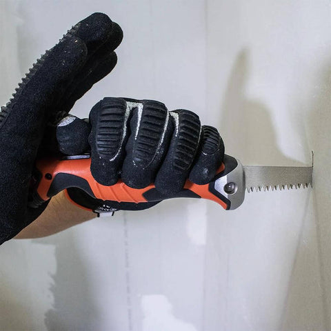Side view of Klein Tools 31737 folding jab saw with orange/black handle and extended serrated blade.