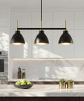 Black And Gold 3 Light Linear Kitchen Island Pendant With Adjustable Rods installed in modern kitchen over island.