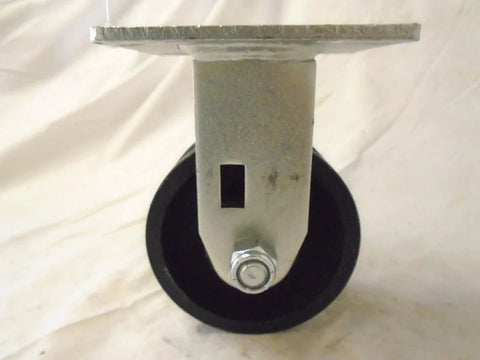Front view of 4x2 in rigid caster with 7/8 in V-groove steel wheel on mounting plate.