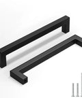Two matte black cabinet pulls with square design, 6 5 16 inch hole centers, and screws from 25 Pack Matte Black Cabinet Pulls set.