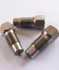 Three metal threaded adapters with hex heads for HP water valve in waterjet cutting systems