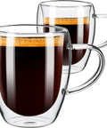 Grab These Sleek Double Wall Glass Coffee Mugs Set Of Two, Tough Borosilicate Build Keeps Your Daily Grind Straight Fire Or Icy Fresh, Ergonomic Handle Design viewed with hot coffee inside.