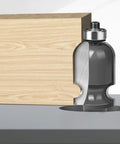 Get Your Hands On This 1/2 Inch Shank Architectural Molding Router Bit For Smooth Flush Trimming Of Laminate and Veneer With Precision Face Milling Perfection Every Single Time For Serious Woodworking Pros Who Demand Flawless Edges, showing a carbide bit cutting through wood.