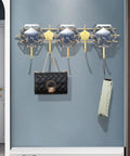 Heavy Duty Five Hook Wall Mount Coat Rack Sleek Steel Storage Bar For Zero Clutter Entryway Bedroom with bags and umbrellas.