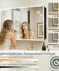 Woman using LED Medicine Cabinet 48 By 32 Inch With Demister, Dimmable Interior Lighting, Three Color Temperature in bathroom