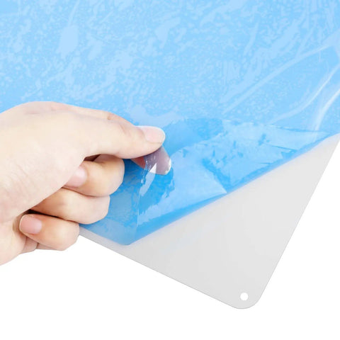 Hand peeling blue protective film from a Four Pack White Sign Blanks 14 X 10 Inches Hella Durable Rust Free Aluminum Metal Sheets.