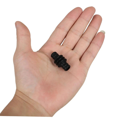Hand holding Rubber Steam Wand Cover For Espresso Makers With Heat Insulation Sleeve, showcasing compact design