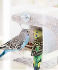 Zero Mess Parrot Automatic Feeder For Budgerigars And Canaries With Screw Fixed Cage Mount Plus High Capacity Seed Dispenser And Built In Perch, showing two budgerigars using the feeder.