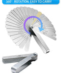 Feeler gauge set with 32 stainless steel blades in a folding fan; dual metric and SAE markings; metal storage case